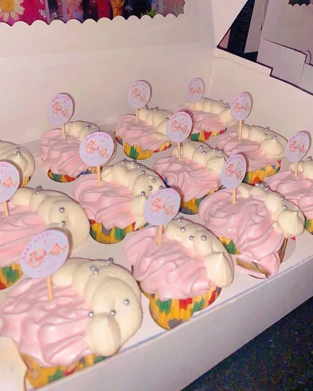 Beautifully decorated gender reveal cupcakes with pink theme for baby announcement celebration - Celebration Cupcakes Karachi By Whisk And Sift